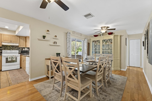 11711 Laurel Valley Cir, Wellington, FL 33414 - dining space featuring light wood finished floors, baseboards, a ceiling fan, and visible vents