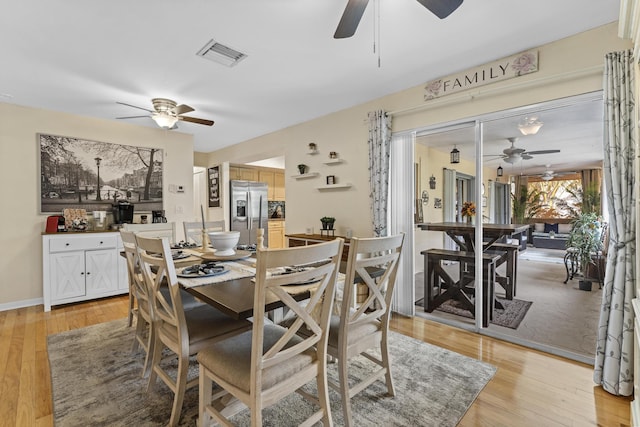 11711 Laurel Valley Cir, Wellington, FL 33414 - dining area featuring visible vents, light wood-style flooring, and ceiling fan