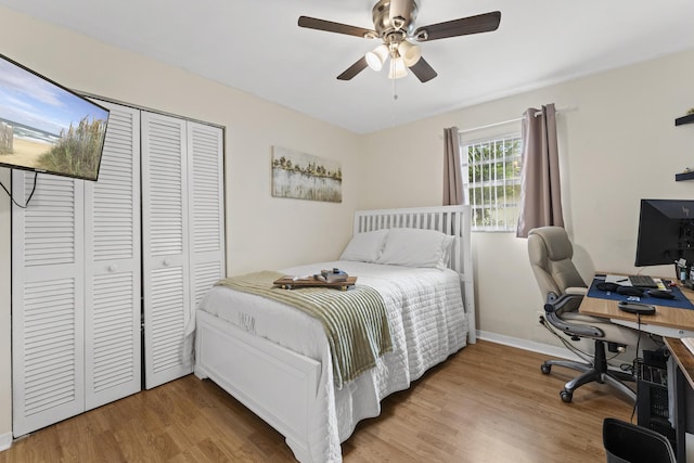 11711 Laurel Valley Cir, Wellington, FL 33414 - bedroom with a closet, baseboards, a ceiling fan, and wood finished floors