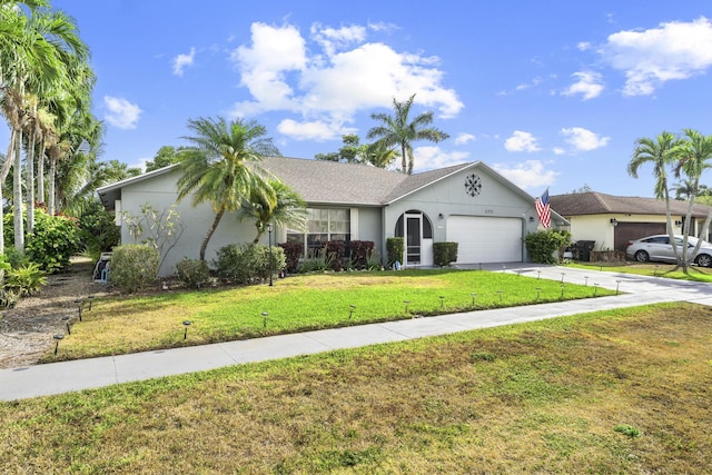 11711 Laurel Valley Cir, Wellington, FL 33414 - ranch-style house with an attached garage, concrete driveway, stucco siding, and a front yard