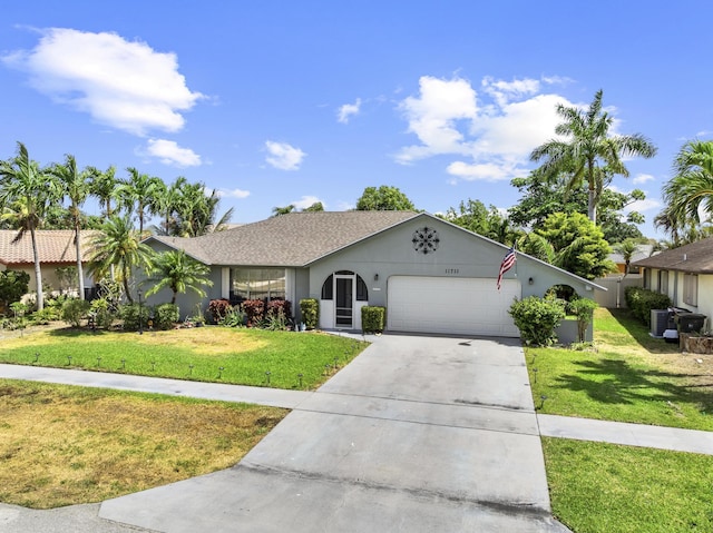 11711 Laurel Valley Cir, Wellington, FL 33414 - single story home featuring stucco siding, concrete driveway, a garage, and a front lawn