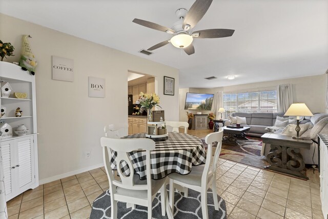 11711 Laurel Valley Cir, Wellington, FL 33414 - dining area with ceiling fan, baseboards, light tile patterned floors, and visible vents