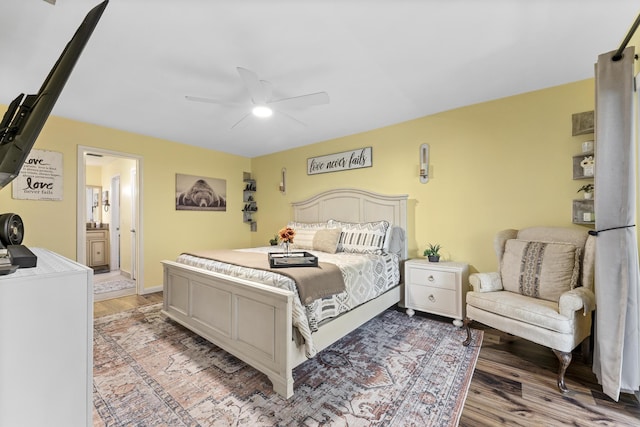 11711 Laurel Valley Cir, Wellington, FL 33414 - bedroom with light wood-style flooring, ensuite bath, and a ceiling fan