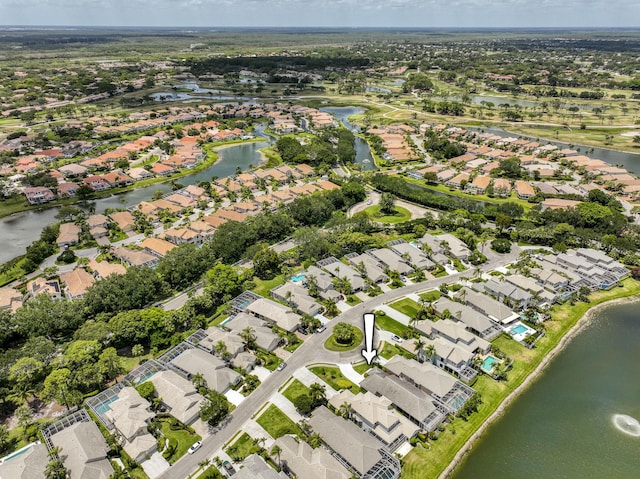 aerial overview of property's location featuring nearby suburban area and a nearby body of water
