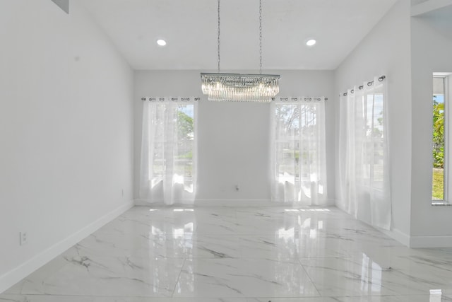 2449 SE Rock Springs Dr, Port Saint Lucie, FL 34952 - unfurnished dining area featuring a chandelier, baseboards, marble tiled flooring, and recessed lighting
