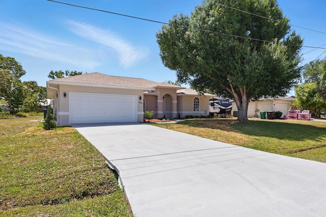 2449 SE Rock Springs Dr, Port Saint Lucie, FL 34952 - ranch-style house with stucco siding, a garage, concrete driveway, and a front yard