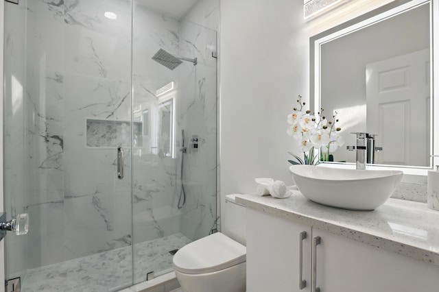 2449 SE Rock Springs Dr, Port Saint Lucie, FL 34952 - bathroom with a marble finish shower, toilet, and vanity