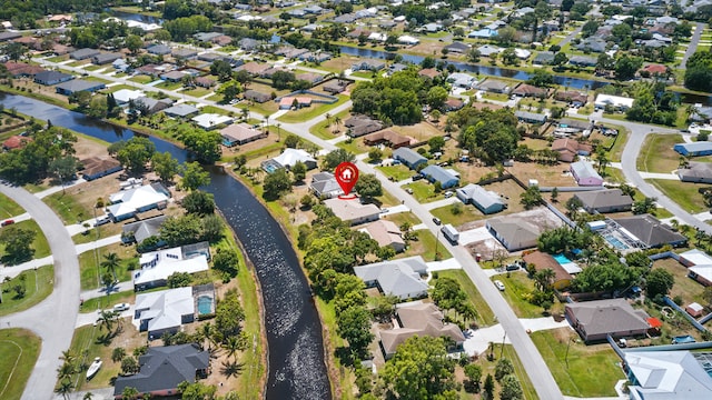 2449 SE Rock Springs Dr, Port Saint Lucie, FL 34952 - aerial view of property and surrounding area with nearby suburban area and a nearby body of water