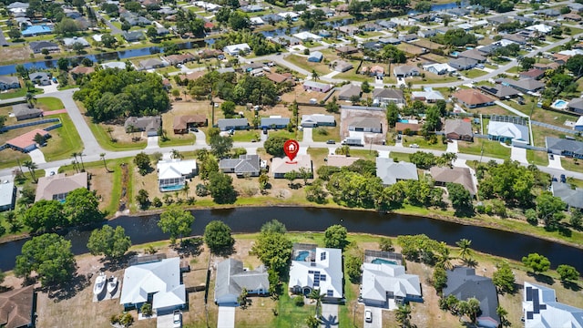 2449 SE Rock Springs Dr, Port Saint Lucie, FL 34952 - aerial overview of property's location with nearby suburban area