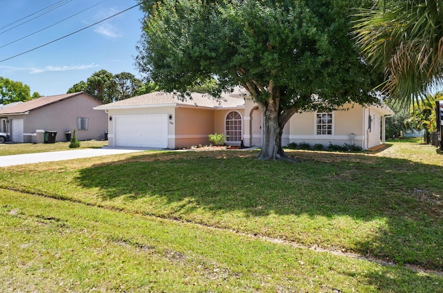 2449 SE Rock Springs Dr, Port Saint Lucie, FL 34952 - view of front of house featuring stucco siding, driveway, an attached garage, and a front lawn