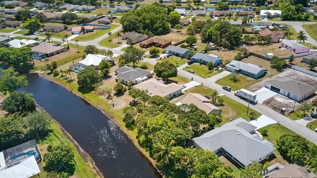 2449 SE Rock Springs Dr, Port Saint Lucie, FL 34952 - aerial overview of property's location featuring nearby suburban area and a nearby body of water