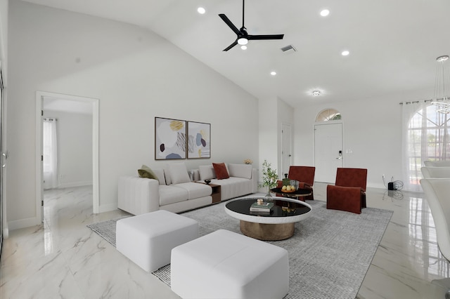 2449 SE Rock Springs Dr, Port Saint Lucie, FL 34952 - living room featuring light marble finish flooring, recessed lighting, ceiling fan, high vaulted ceiling, and baseboards