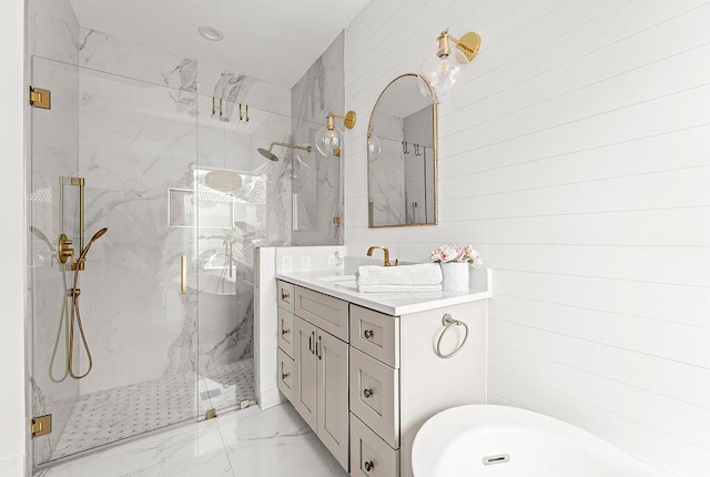 full bathroom featuring a sink, a marble finish shower, double vanity, and marble finish floor