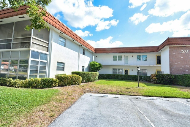 1225 NW 21st St Unit 2010, Stuart, FL 34994 - view of property featuring uncovered parking