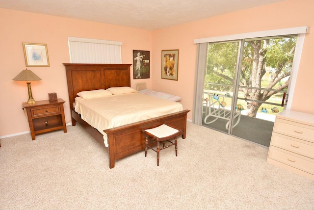1225 NW 21st St Unit 2010, Stuart, FL 34994 - bedroom with light carpet and access to exterior