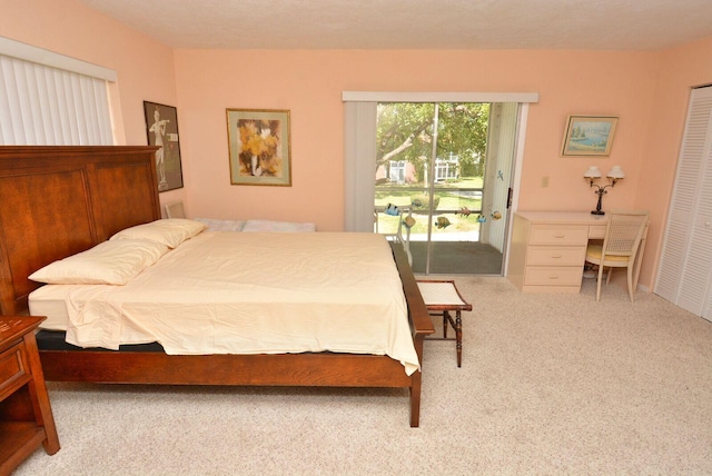 1225 NW 21st St Unit 2010, Stuart, FL 34994 - bedroom featuring carpet floors, access to outside, and a closet
