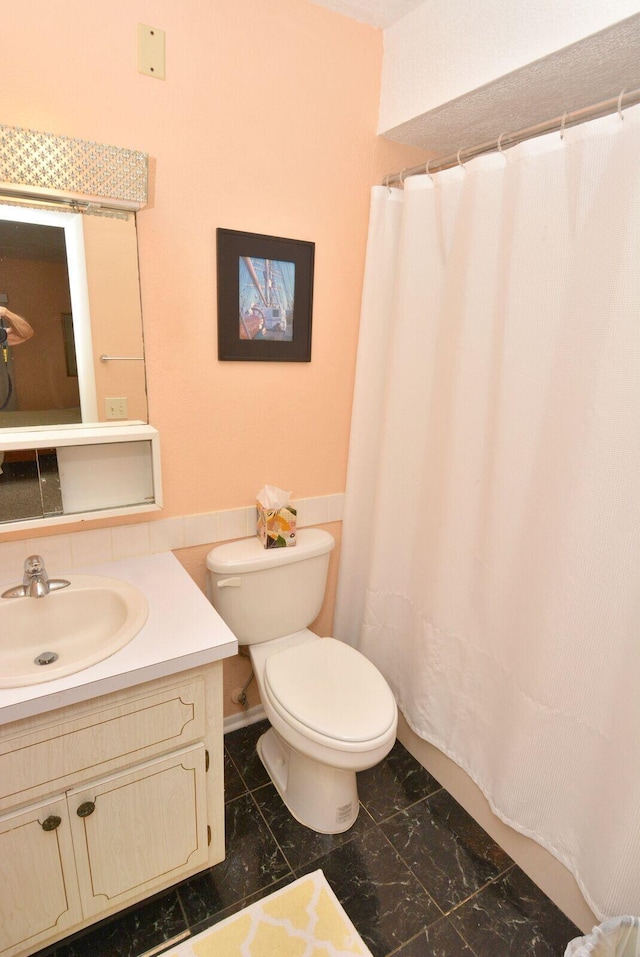 1225 NW 21st St Unit 2010, Stuart, FL 34994 - bathroom with vanity, marble finish floor, toilet, and a shower with curtain