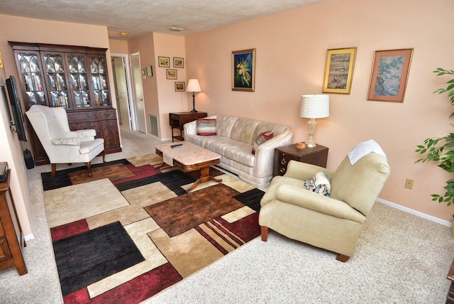 1225 NW 21st St Unit 2010, Stuart, FL 34994 - carpeted living area featuring a textured ceiling, baseboards, and visible vents