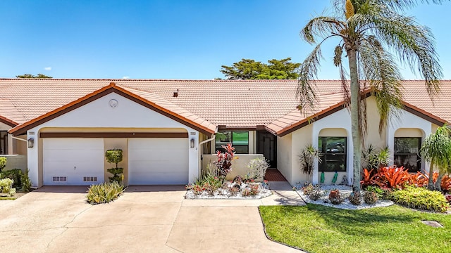 8216 Waterline Dr, Boynton Beach, FL 33472 - view of front of house featuring concrete driveway, an attached garage, a tile roof, and stucco siding