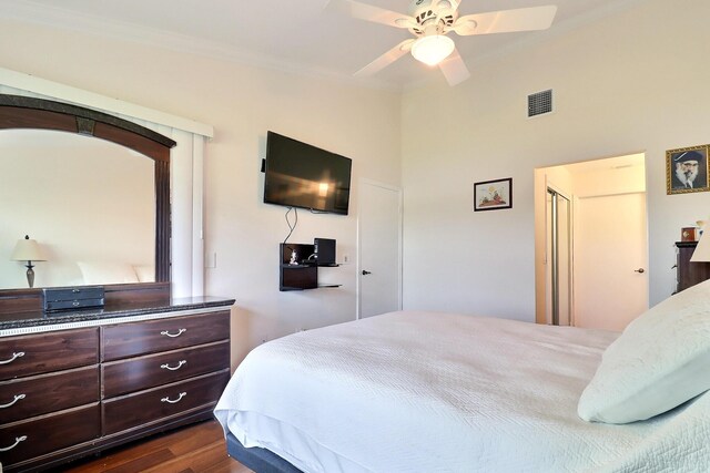 8216 Waterline Dr, Boynton Beach, FL 33472 - bedroom with visible vents, ornamental molding, dark wood-type flooring, and a ceiling fan