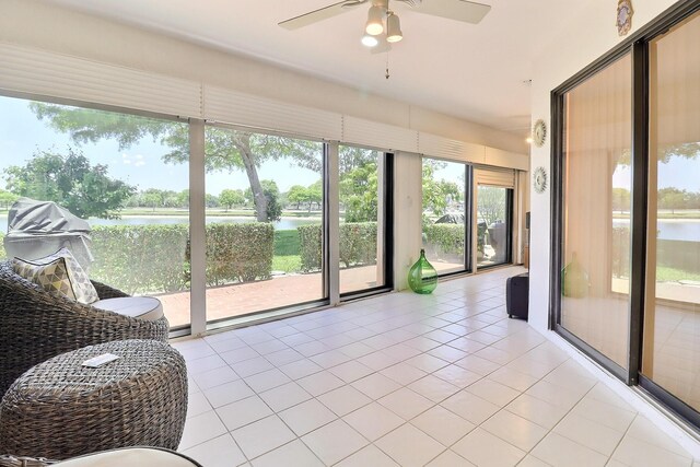 8216 Waterline Dr, Boynton Beach, FL 33472 - sunroom / solarium with a ceiling fan, tile patterned floors, and a water view