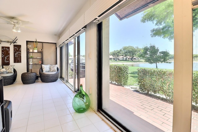 8216 Waterline Dr, Boynton Beach, FL 33472 - sunroom / solarium featuring a water view, ceiling fan, and tile patterned flooring