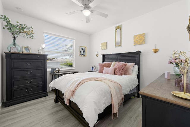 bedroom with ceiling fan and light wood-type flooring