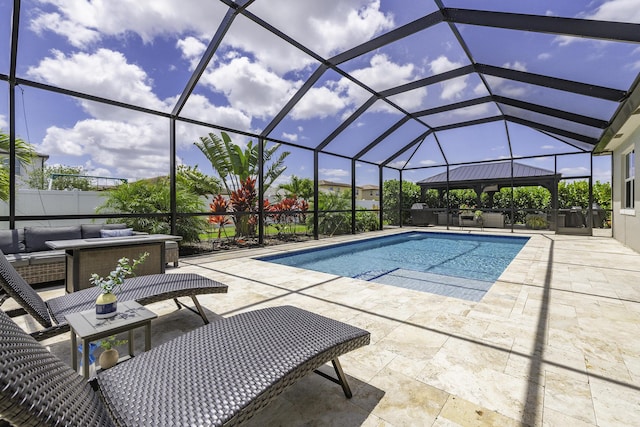 outdoor pool with an outdoor living space, glass enclosure, and a patio area