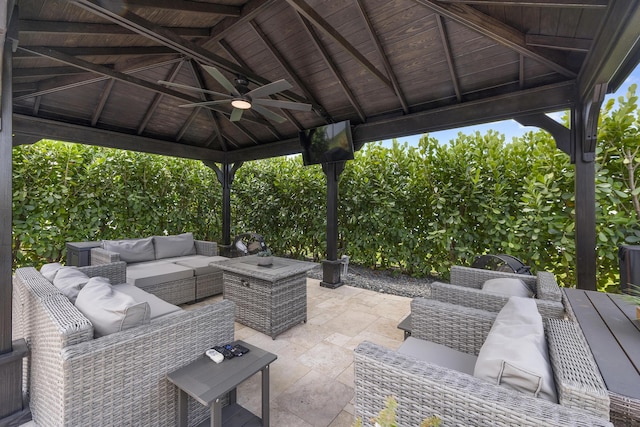 view of patio / terrace featuring a gazebo, outdoor lounge area, and ceiling fan