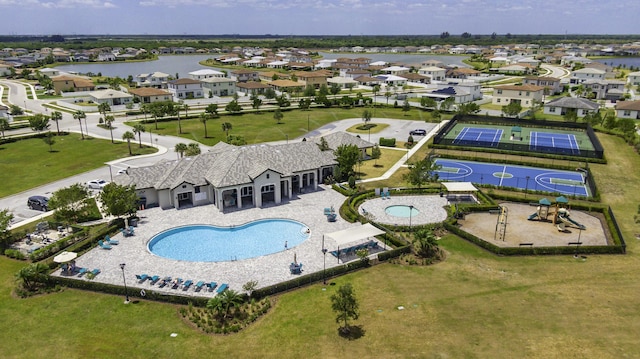 bird's eye view featuring a water view and a residential view