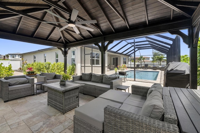 7509 NW Greenspring St, Port Saint Lucie, FL 34987 - view of patio featuring an outdoor hangout area, a ceiling fan, area for grilling, glass enclosure, and a gazebo