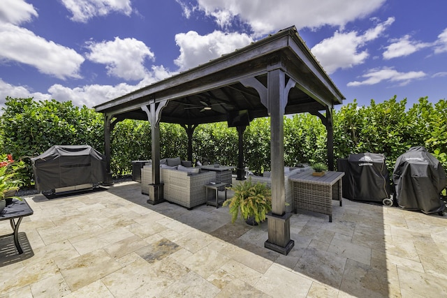 view of patio featuring a gazebo, area for grilling, and outdoor lounge area