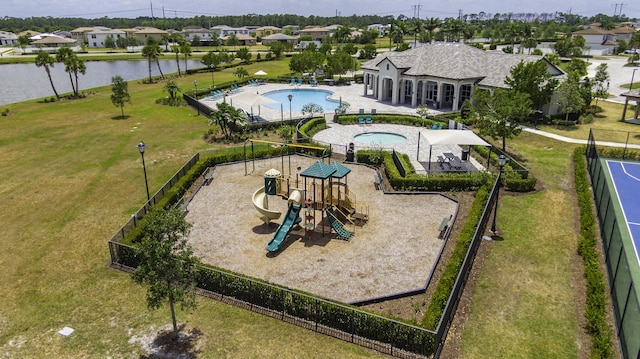 birds eye view of property featuring a water view and a residential view