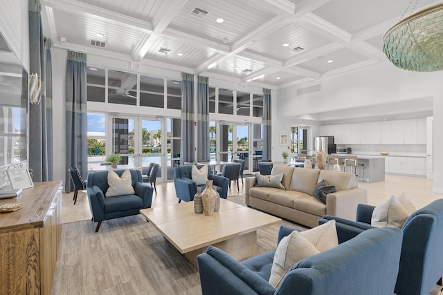 living room featuring visible vents, a towering ceiling, beam ceiling, coffered ceiling, and recessed lighting