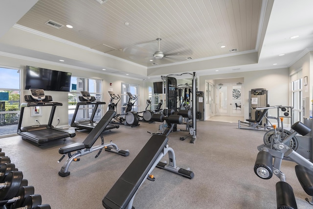gym featuring visible vents, plenty of natural light, and a raised ceiling
