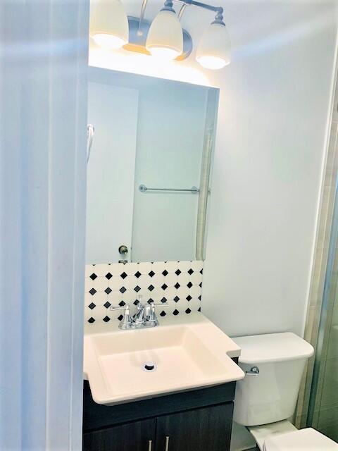 2821 Duke Ln, Delray Beach, FL 33445 - bathroom with vanity and toilet