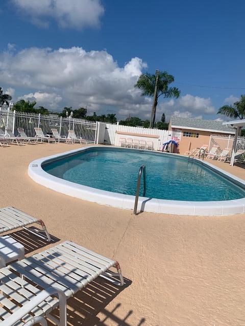 2821 Duke Ln, Delray Beach, FL 33445 - pool with fence and a patio area