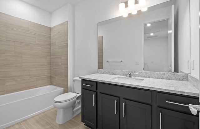 7646 SW Lucy Ln Unit 52-10, Stuart, FL 34997 - full bath with vanity, toilet,  shower combination, and wood finished floors