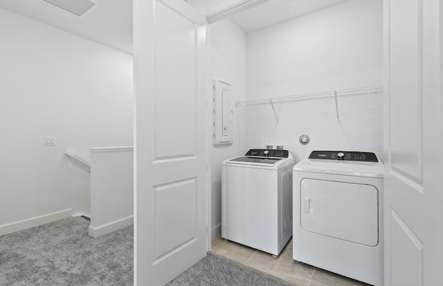 7636 SW Lucy Ln Unit Latitude 48-09, Stuart, FL 34997 - laundry room featuring washer and dryer, baseboards, and electric panel