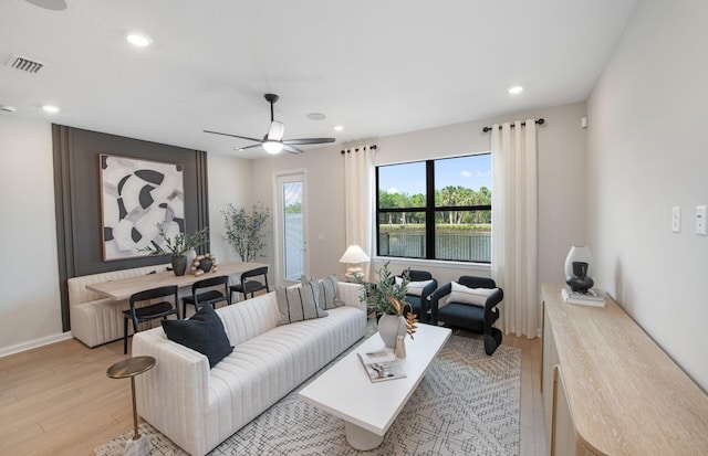 7636 SW Lucy Ln Unit Latitude 48-09, Stuart, FL 34997 - living area featuring light wood-style floors, recessed lighting, ceiling fan, and baseboards