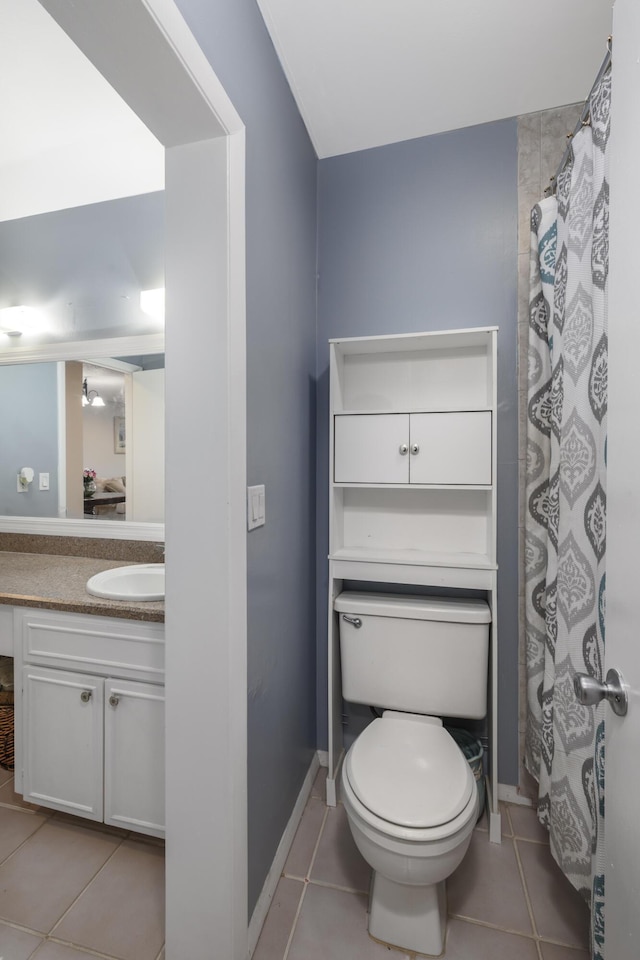 full bathroom with a shower with curtain, tile patterned floors, vanity, and toilet