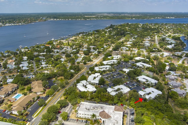 drone / aerial view featuring a water view and a residential view