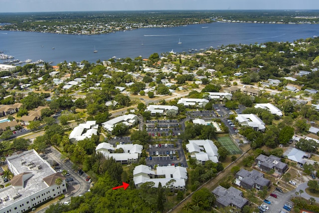 drone / aerial view with a residential view and a water view
