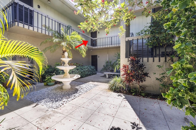 view of home's community featuring a patio area