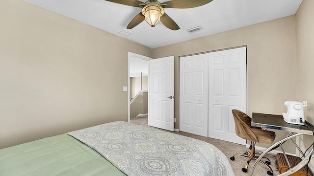 carpeted bedroom with a closet and ceiling fan