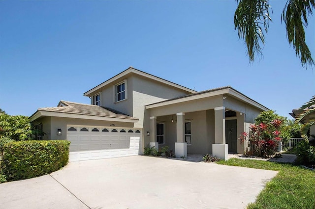 7861 Manor Forest Ln, Boynton Beach, FL 33436 - view of front of house featuring stucco siding, a garage, and driveway