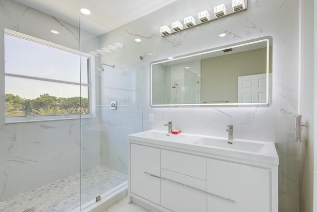 7861 Manor Forest Ln, Boynton Beach, FL 33436 - bathroom with a marble finish shower, double vanity, and tile walls