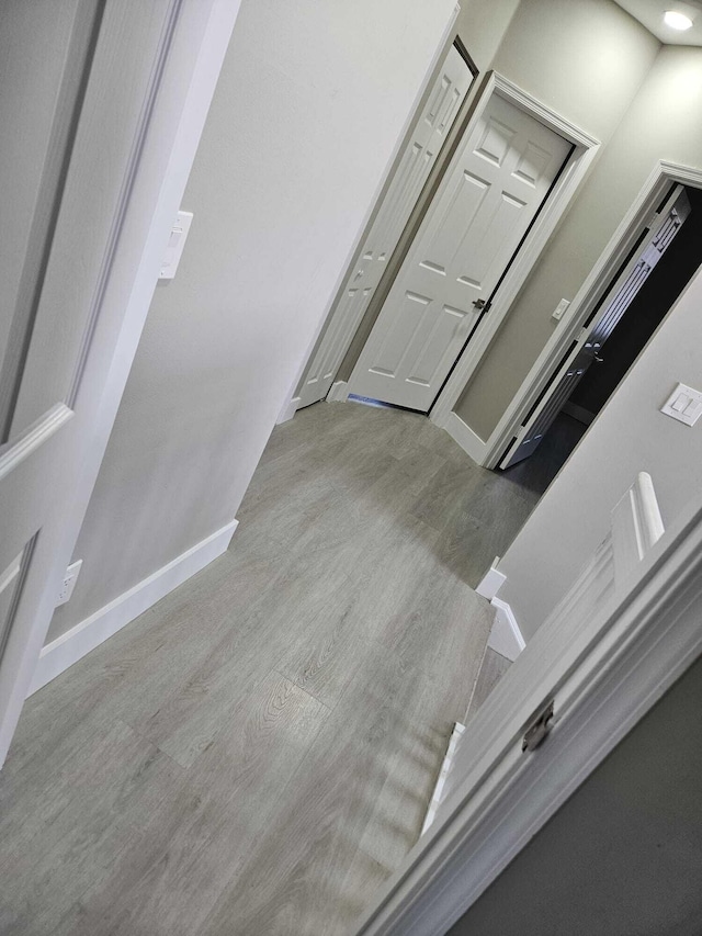 7861 Manor Forest Ln, Boynton Beach, FL 33436 - corridor with wood finished floors and baseboards