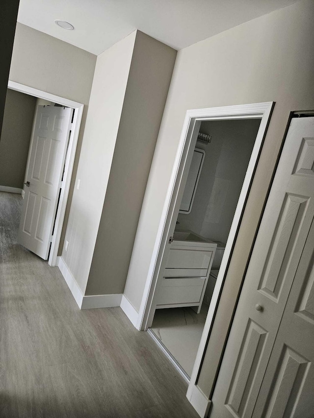 7861 Manor Forest Ln, Boynton Beach, FL 33436 - hall with baseboards and wood finished floors