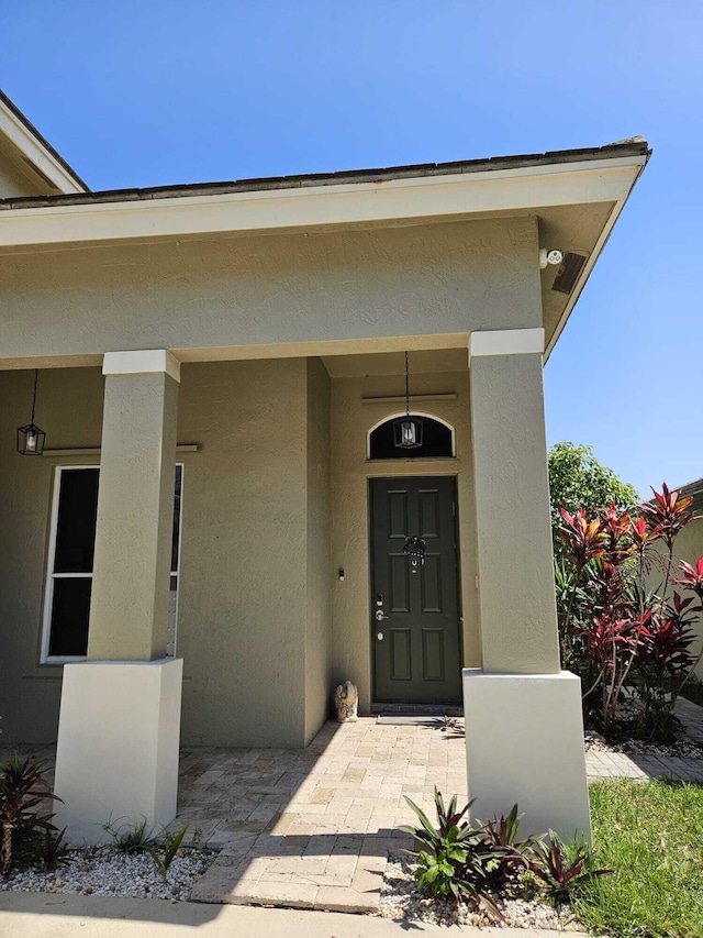 7861 Manor Forest Ln, Boynton Beach, FL 33436 - view of exterior entry with stucco siding
